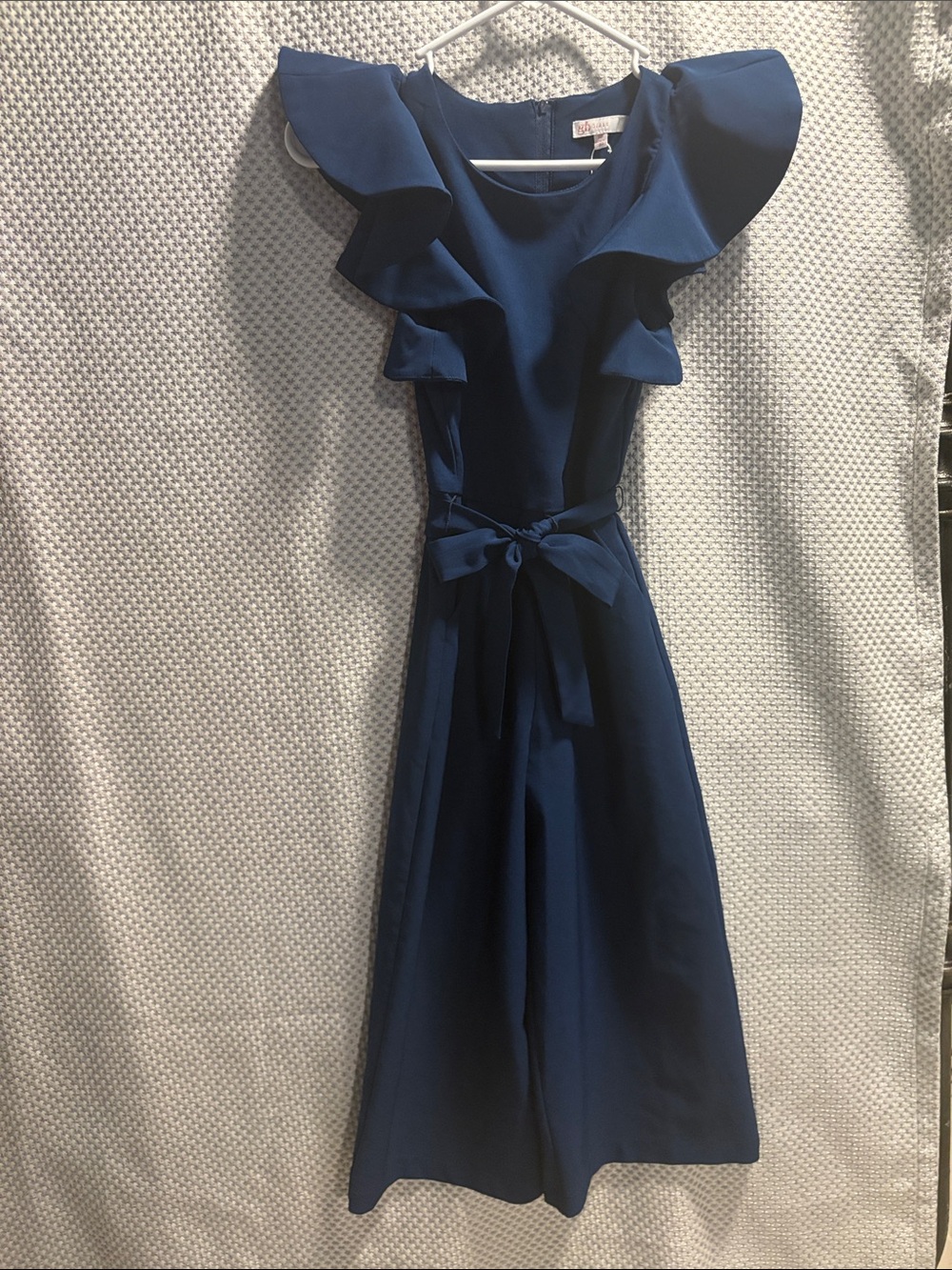 GB girls Navy Ruffle-Shoulder Jumpsuit with Waist Bow